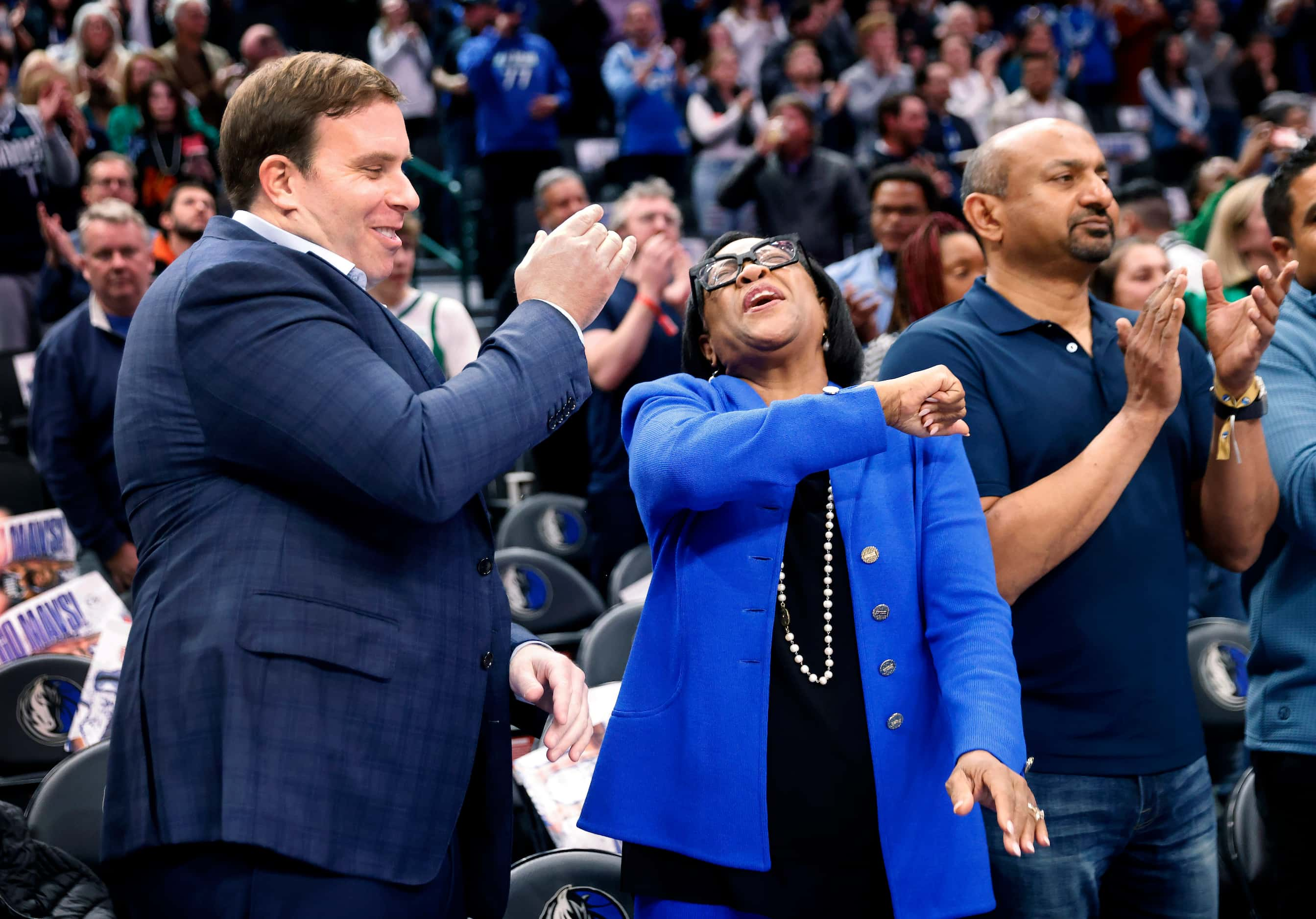 Dallas Mavericks new governor and majority owner Patrick Dumont (left) received a high-five...