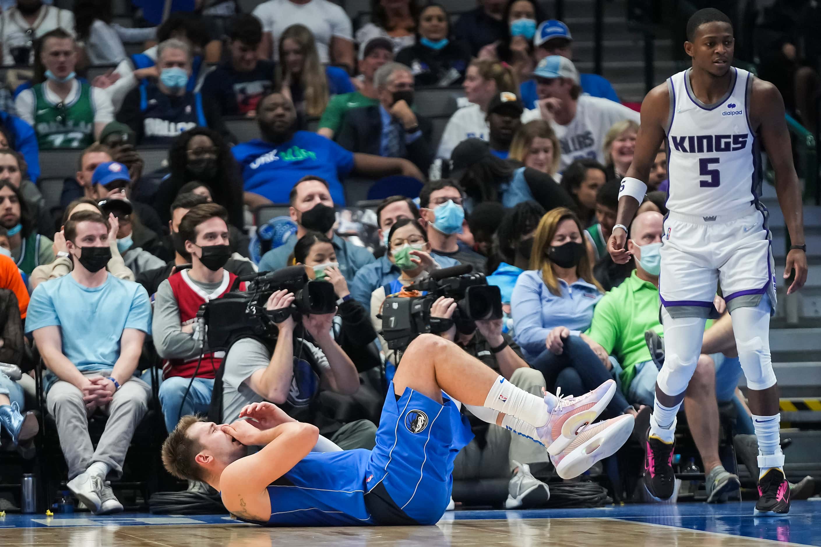 Dallas Mavericks guard Luka Doncic (77) reacts after contact with Sacramento Kings guard...