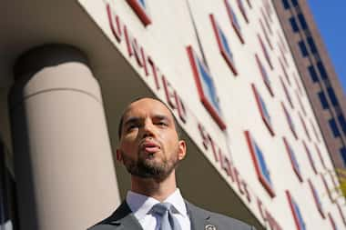 Harris County Clerk Chris Hollins speaks outside the federal courthouse after a hearing...