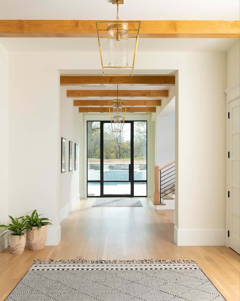 In this entryway Kopfer designed, the walls are Sherwin-Williams' Duration paint in...