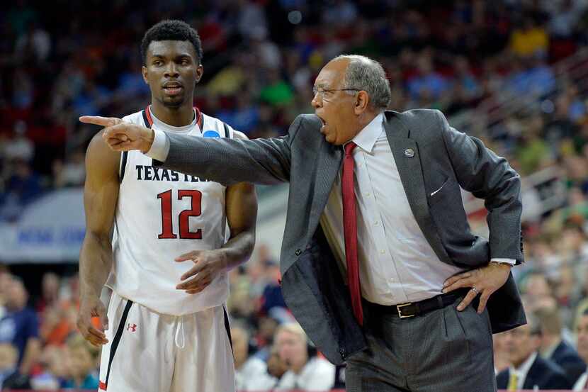 Head coach Tubby Smith of the Texas Tech Red Raiders reacts alongside Keenan Evans #12 in...