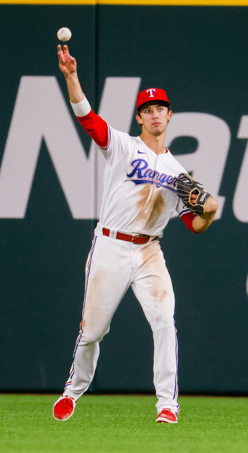 Texas Rangers shortstop Eli White (41) throws the Los Angeles Angels ball back after...