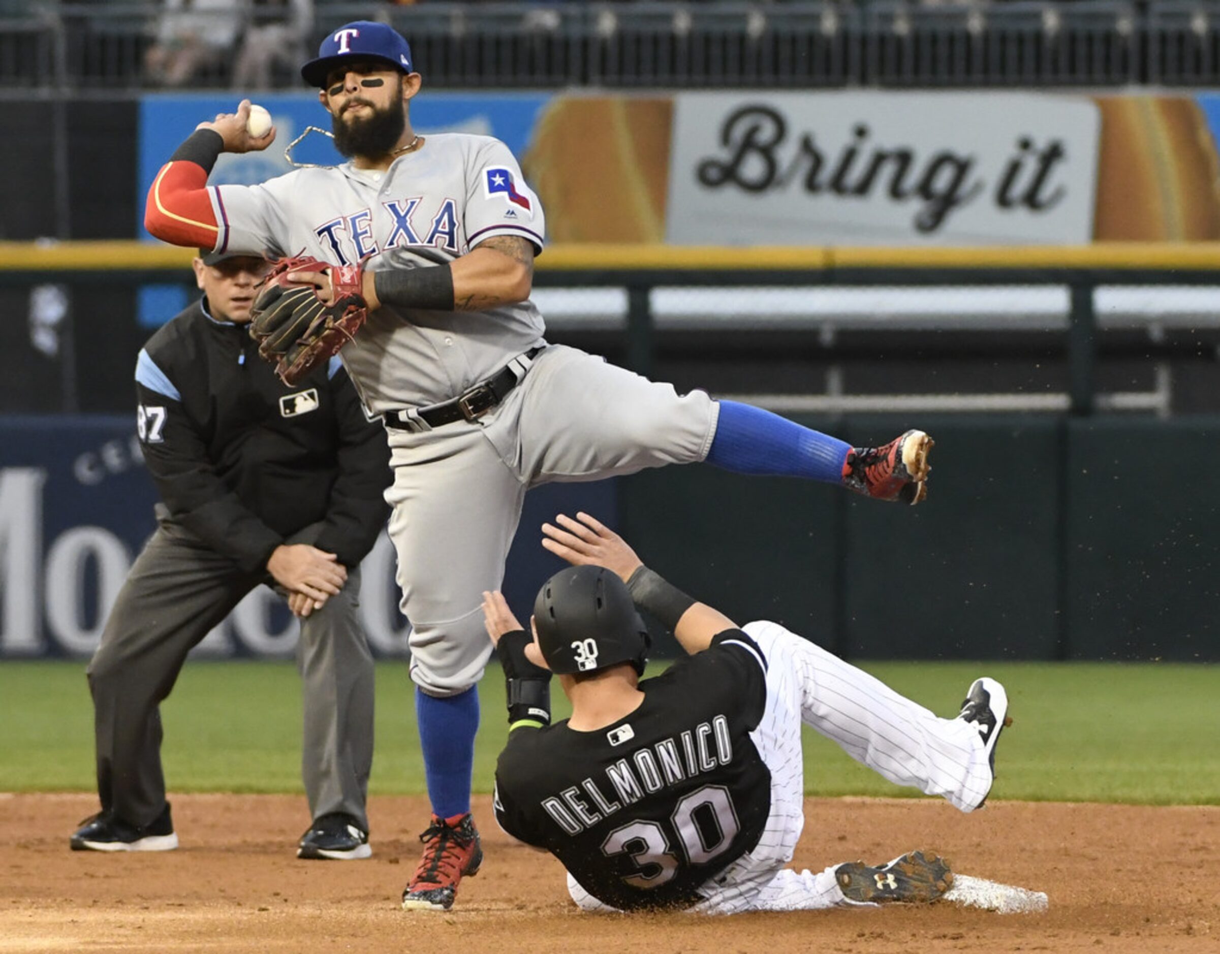 CHICAGO, IL - MAY 17: Rougned Odor #12 of the Texas Rangers foces out Nicky Delmonico #30 of...