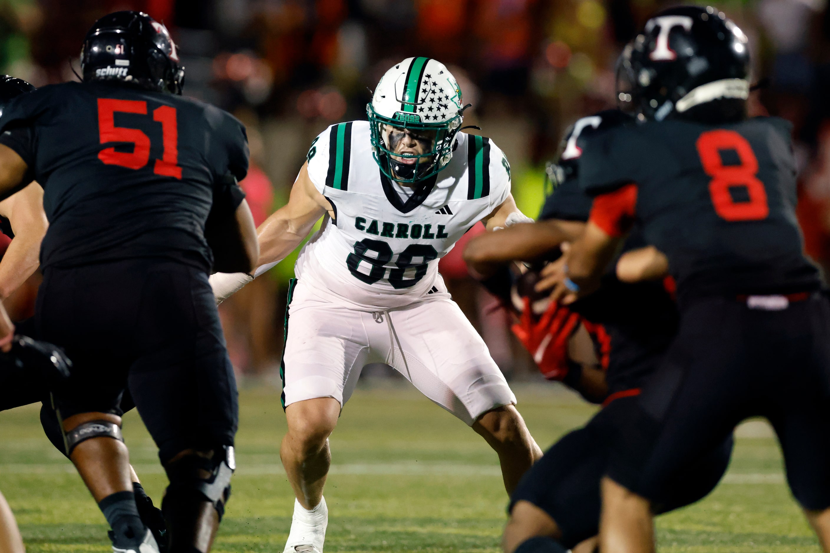 Southlake Carroll defensive lineman Jack Van Dorselaer (88) rushes the line of scrimmage...