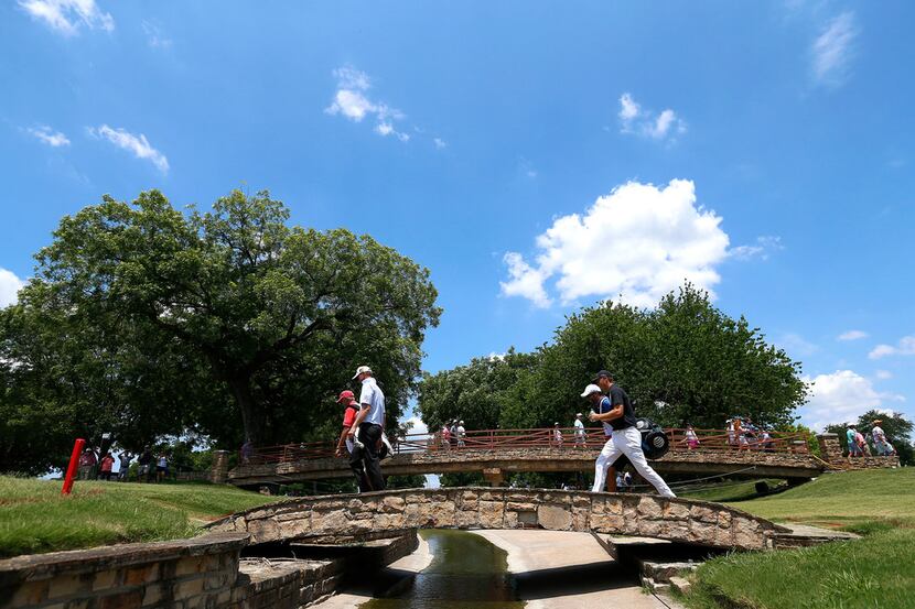 Jordan Spieth, right and Vaughn Taylor walk on the 17th fairway during the final round of...