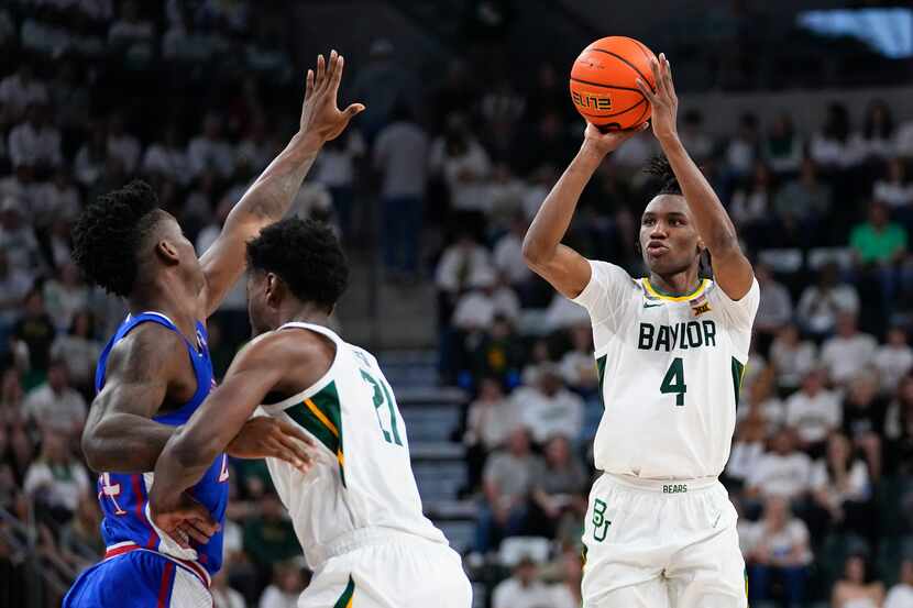 Baylor's Ja'Kobe Walter (4) shoots against Kansas during the first half of an NCAA college...