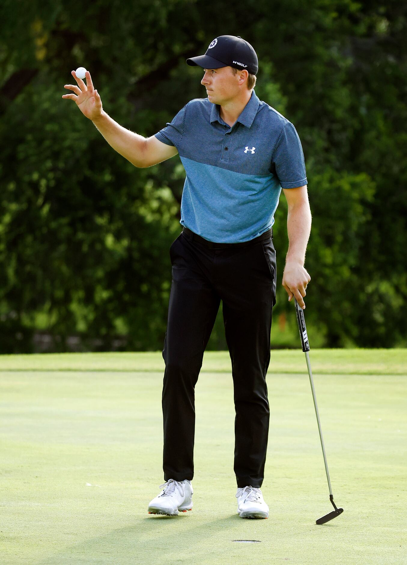 Professional golfer Jordan Spieth acknowledges fans' cheers after making a birdie on No. 18...