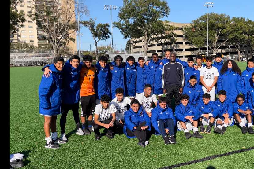Vincenzo Cox with members of the Alief Elsik High School soccer team. The Rams are mostly...