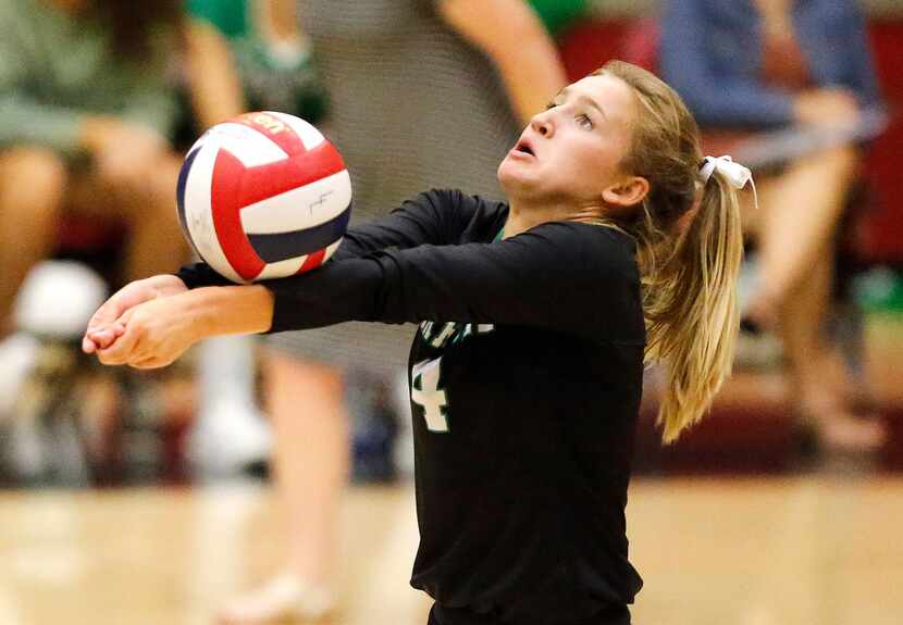 Southlake libero Keagan Polk (4) passes the ball during the first game of the match as...