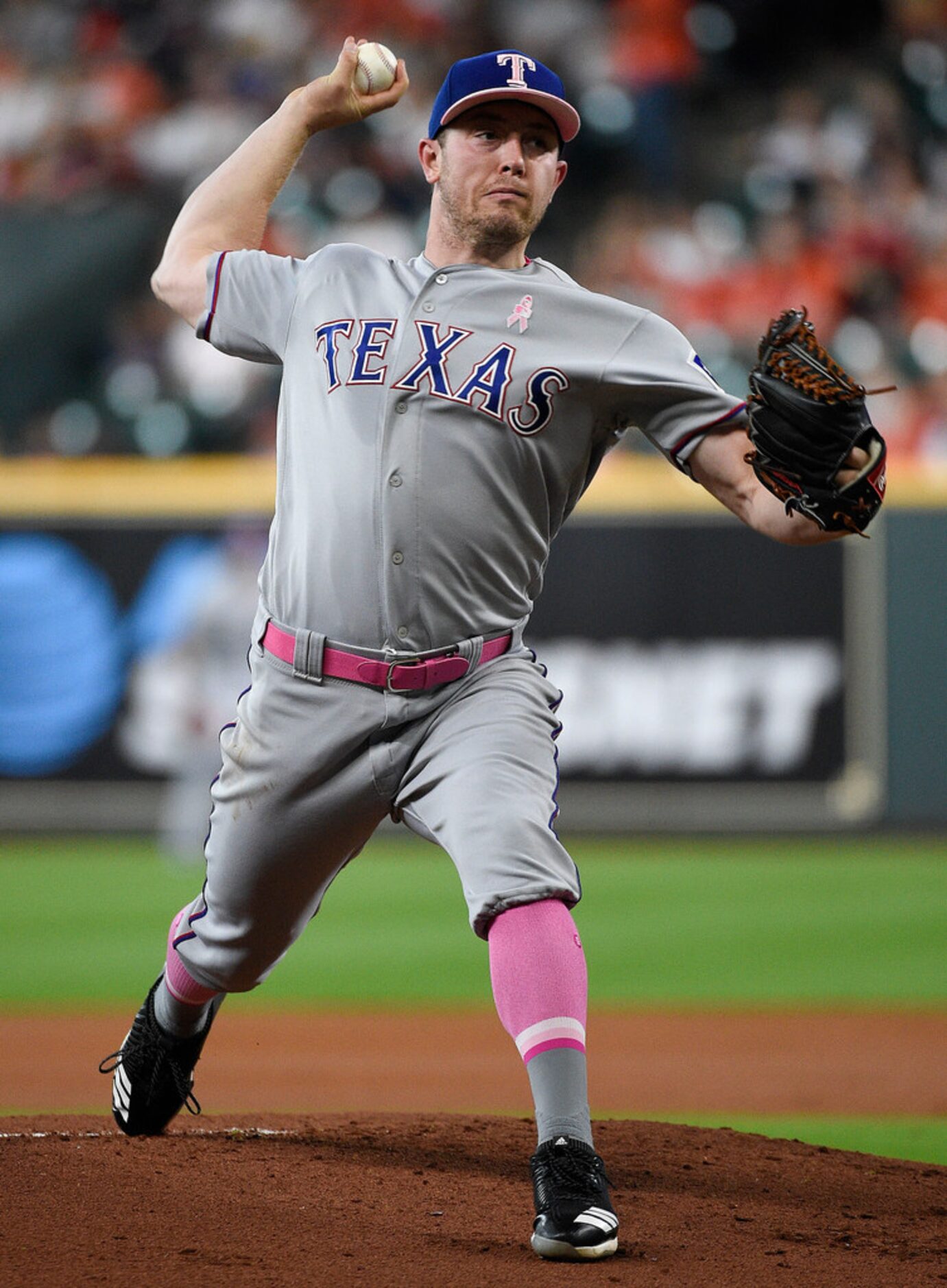 Texas Rangers starting pitcher Adrian Sampson delivers during the first inning of a baseball...