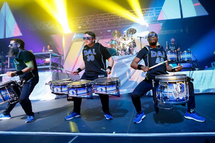 Members of the Dallas Mavericks Drumline perform on stage with Big Gigantic at Bomb Factory...
