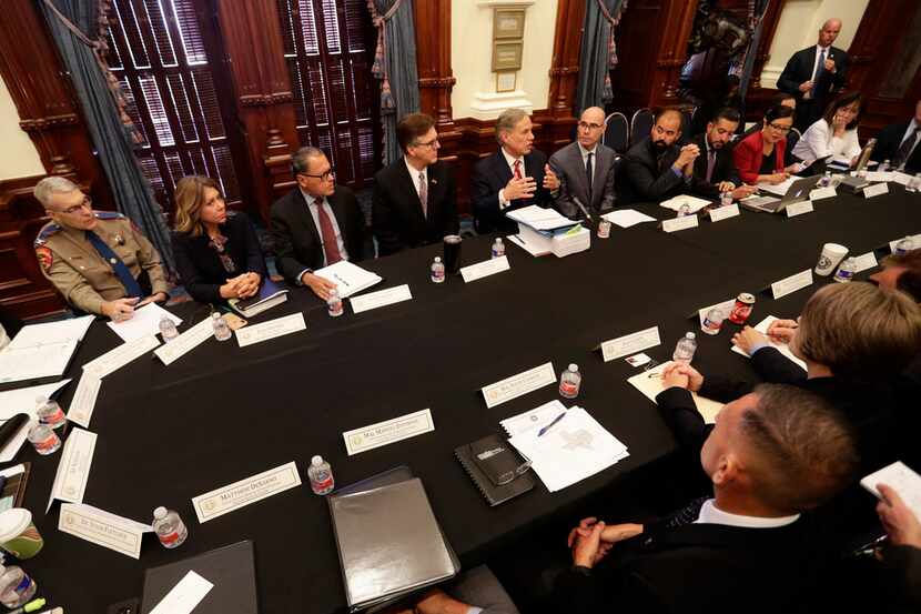 Gov. Greg Abbott (top center) makes opening statements during a round-table discussion at...