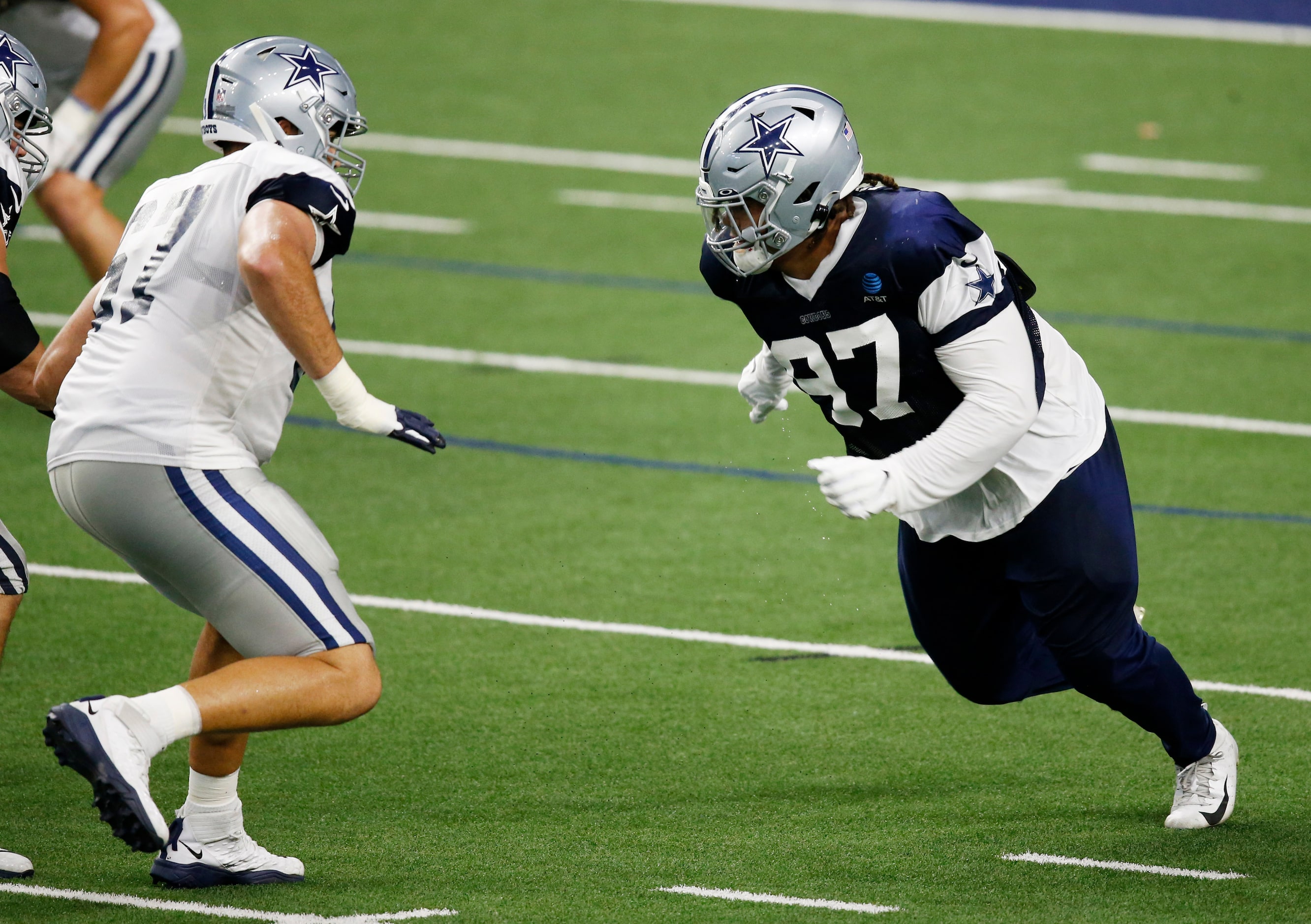 Dallas Cowboys defensive tackle Trysten Hill (97) attempts to pass Dallas Cowboys offensive...