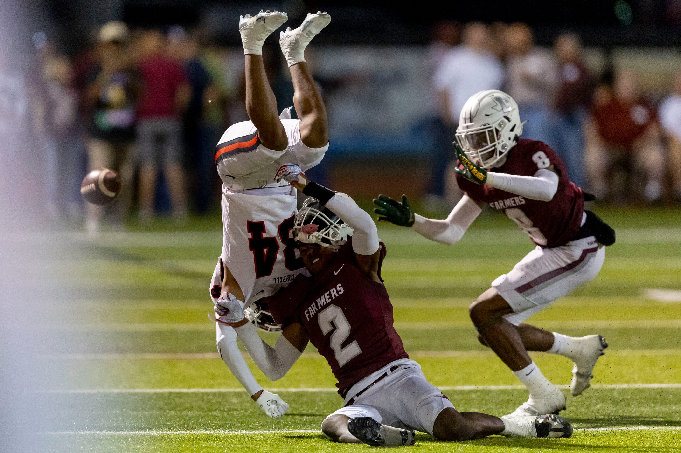 Lewisville senior defensive back Cameren Jenkins (2) tackles Coppell junior wide receiver...