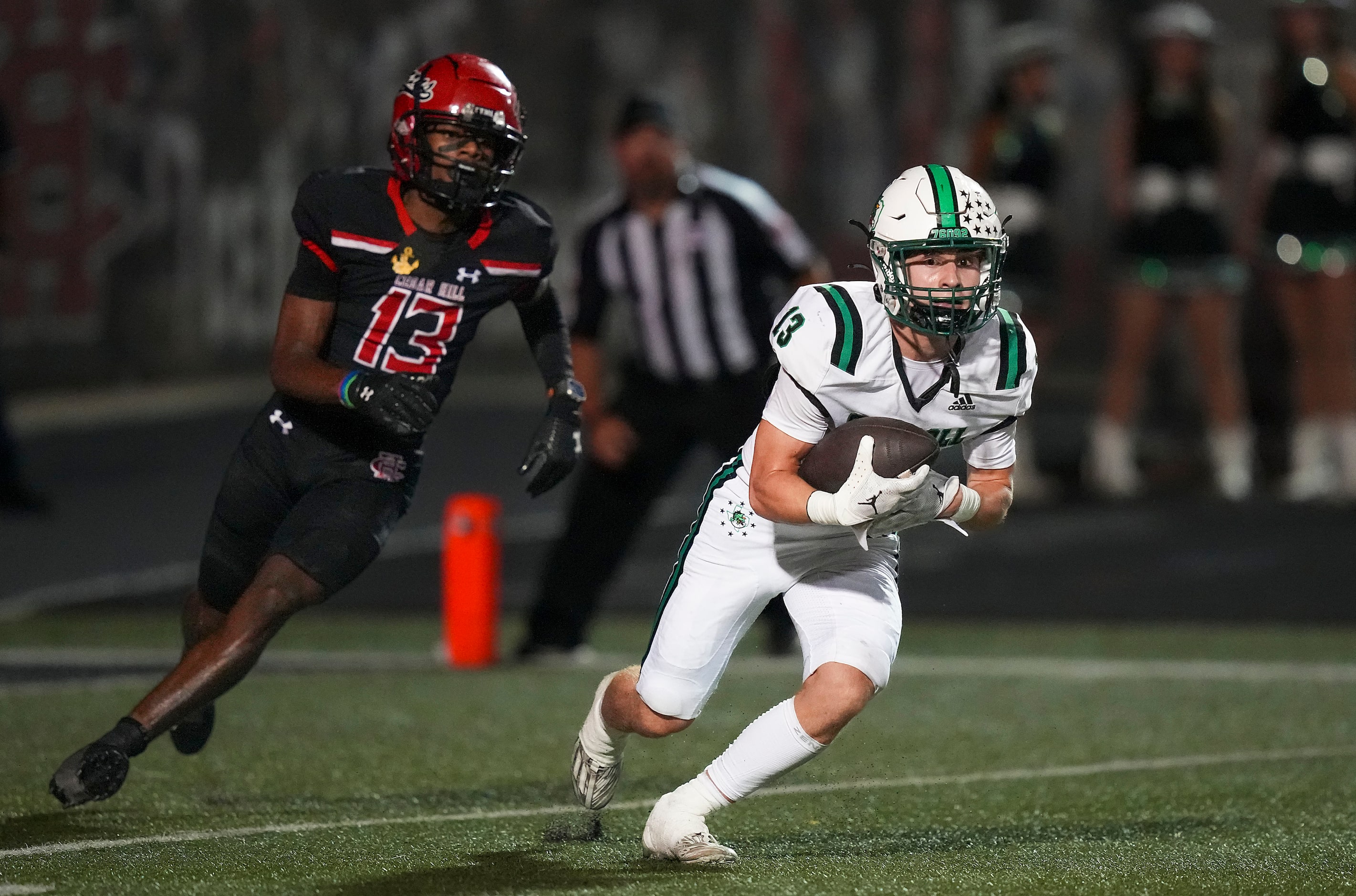 Southlake Carroll defensive back Trey Ferri intercepts a pass intended for Cedar Hill wide...