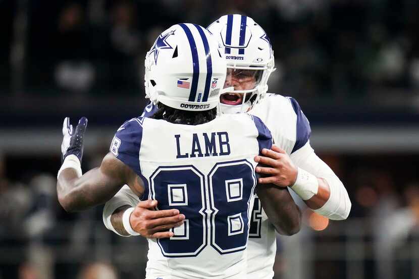 Dallas Cowboys wide receiver CeeDee Lamb (88) celebrates with quarterback Dak Prescott after...