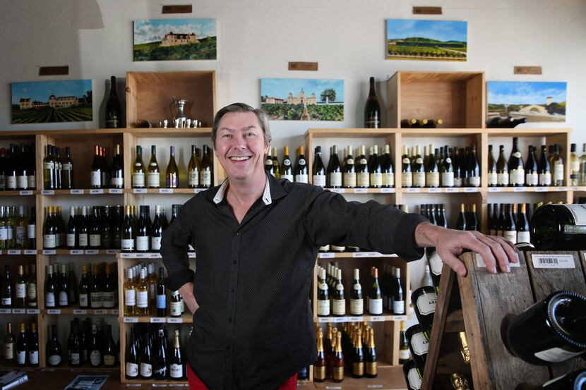 Owner Thierry Plumettaz poses for a photograph at Le Caveau Vinotheque wine shop in Dallas.