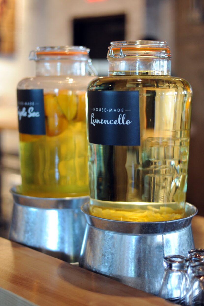 House-made triple sec and limoncello are used in cocktails at the bar at Hopdoddy.