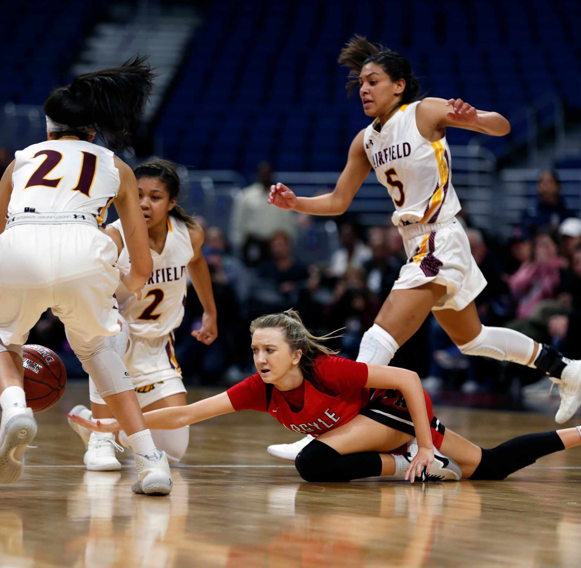 Argyle guard Rhyle McKinney #5 was trapped and lost the ball in closing second of regulation...