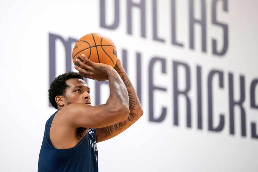 Dallas Mavericks guard Sterling Brown (0) runs through a shooting drill during a training...