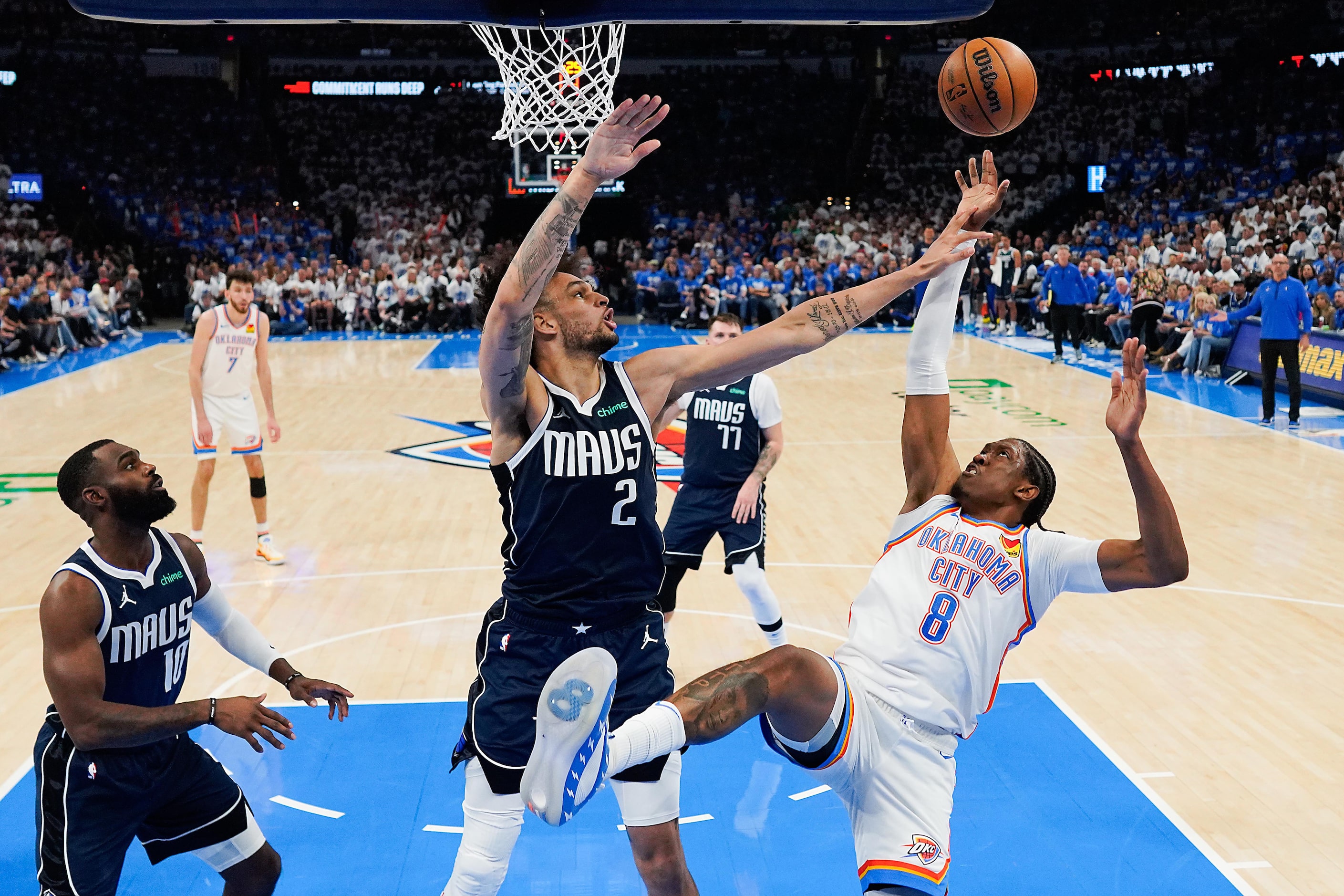 Oklahoma City Thunder forward Jalen Williams (8) is fouled by Dallas Mavericks center Dereck...