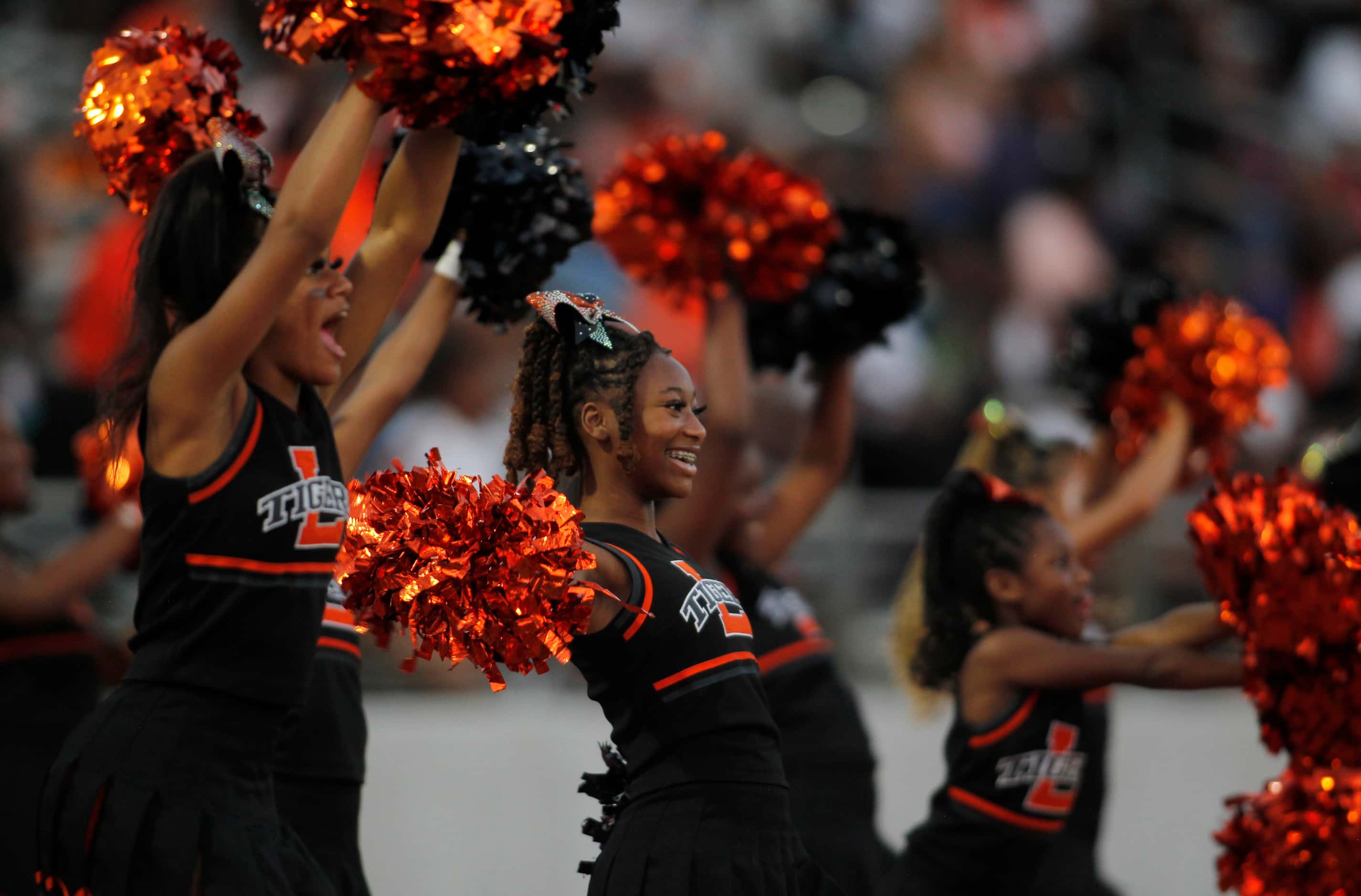 Lancaster cheerleaders react during a first half offensive drive in their game against South...