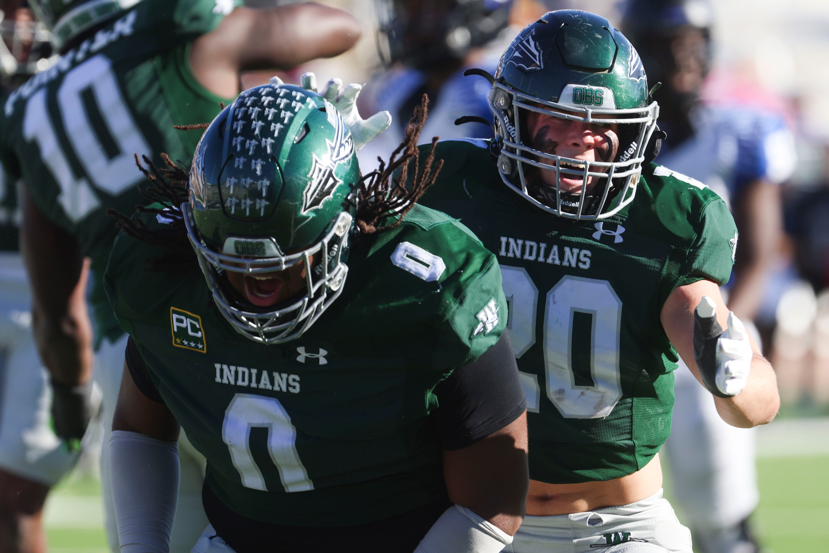 Waxahachie high’s Jacob Ervin (0) and Kaden Tolleson celebrate after sacking North Forney QB...