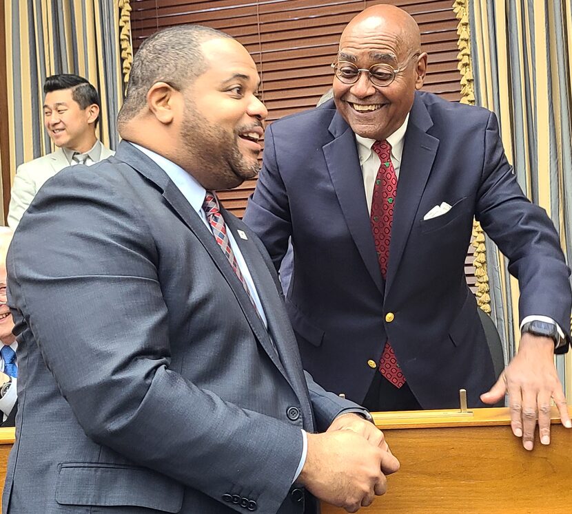 Dallas Mayor Eric Johnson, left, chats with Harris County Commissioner Rodney Ellis on Nov....