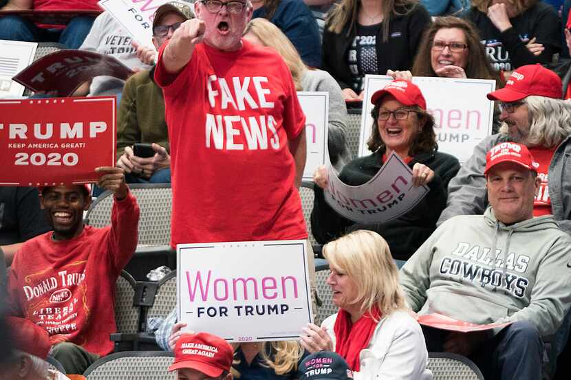 A supporter shouts “fake news” to toward the press pen before President Donald Trump arrived...