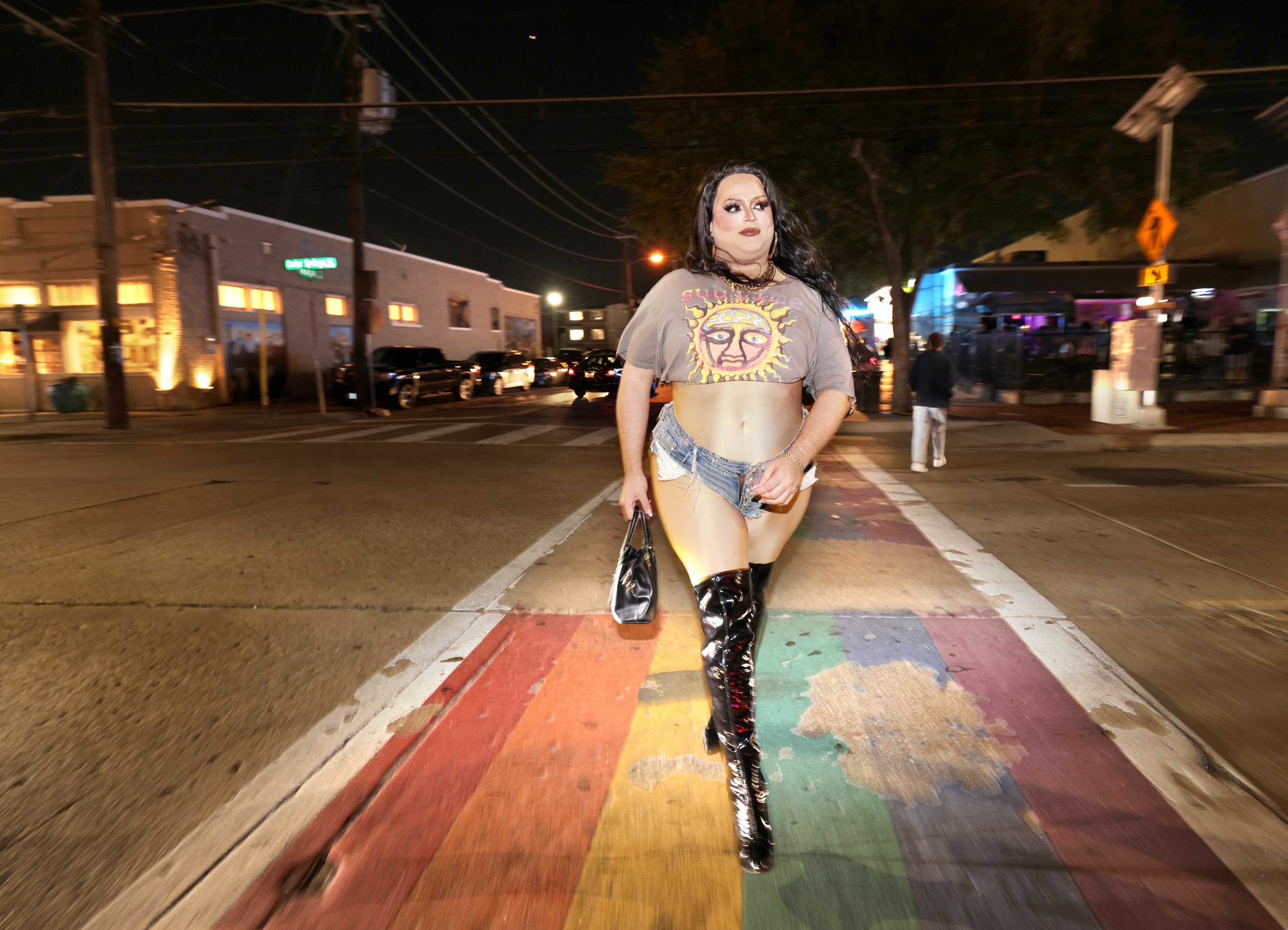 Stage performer Moreliablu walks to a club in the Oak Lawn neighborhood of Dallas, TX, on...