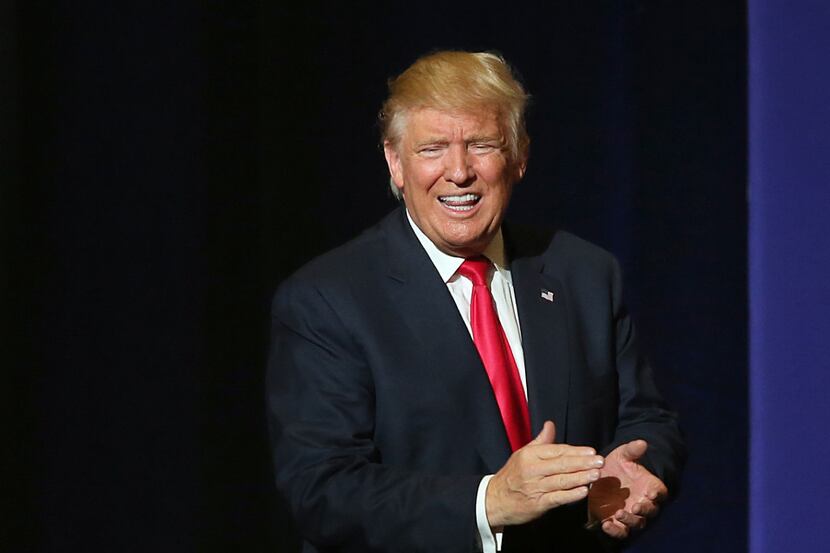 Donald J. Trump, Republican presidential candidate, reacts after speaking during a rally on...