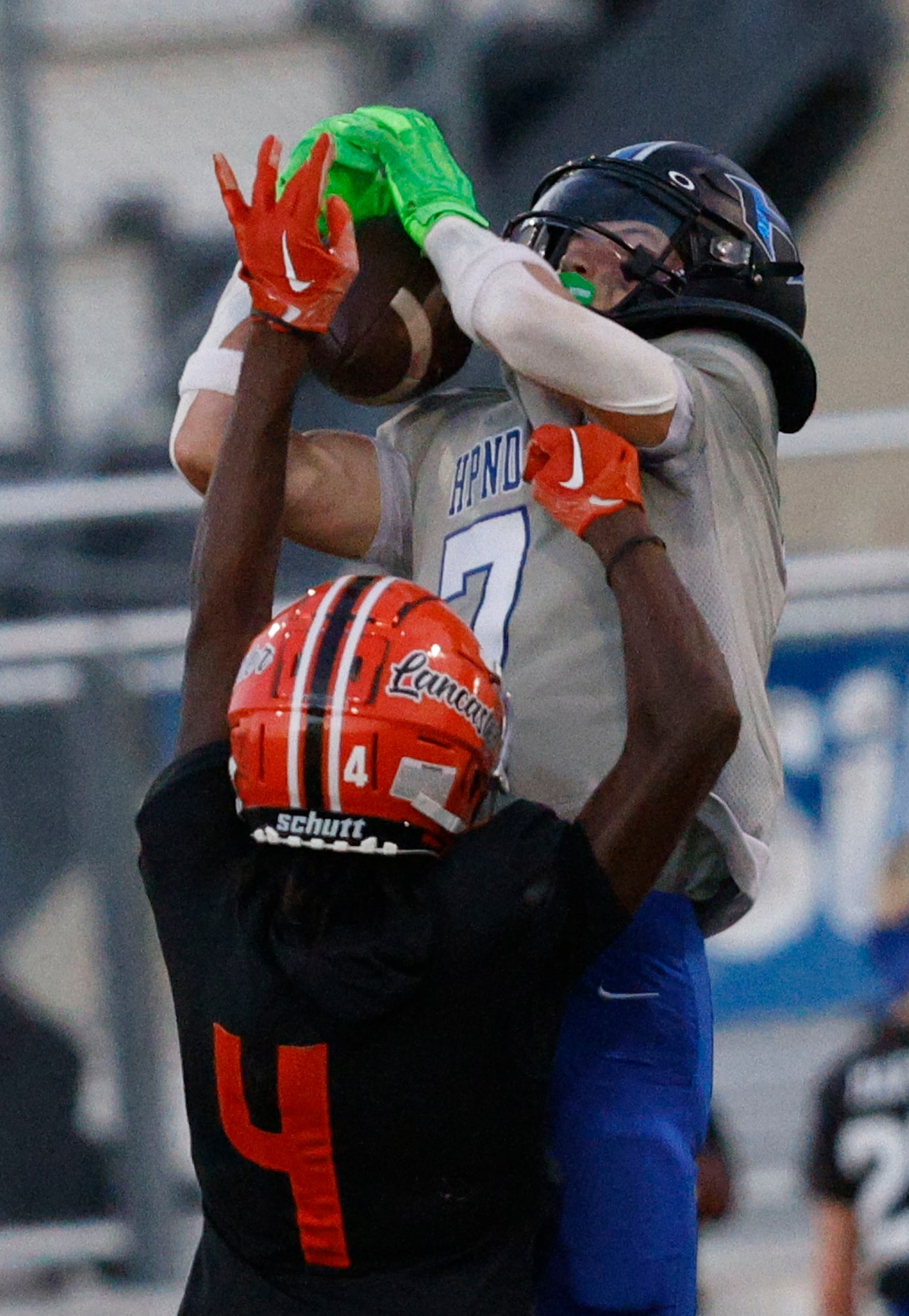 Hebron’s Tyler Hoke (7) catches a pass over Lancaster’s Victor Lincoln (4) in the first half...