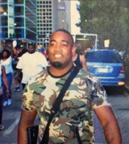 This photo was tweeted by Dallas police showing open carry activist Mark Hughes, with text...