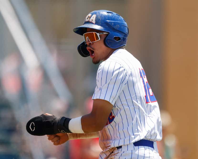 Steven Ramos (12) celebrates after sliding into home in the third inning against Houston St....