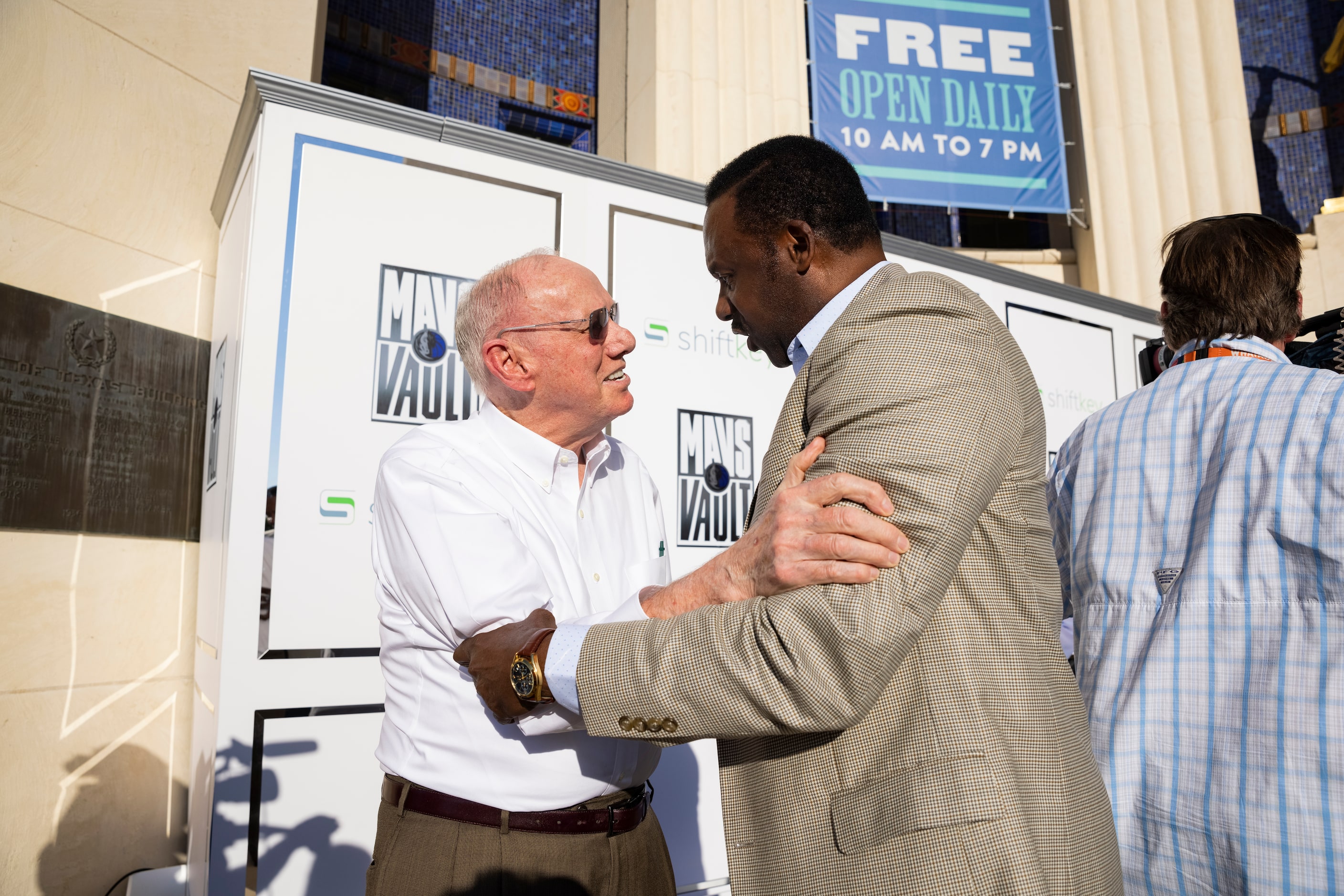 Dallas Mavericks co-founder Norm Sonju speaks to former Mavs player Rolando Blackman before...