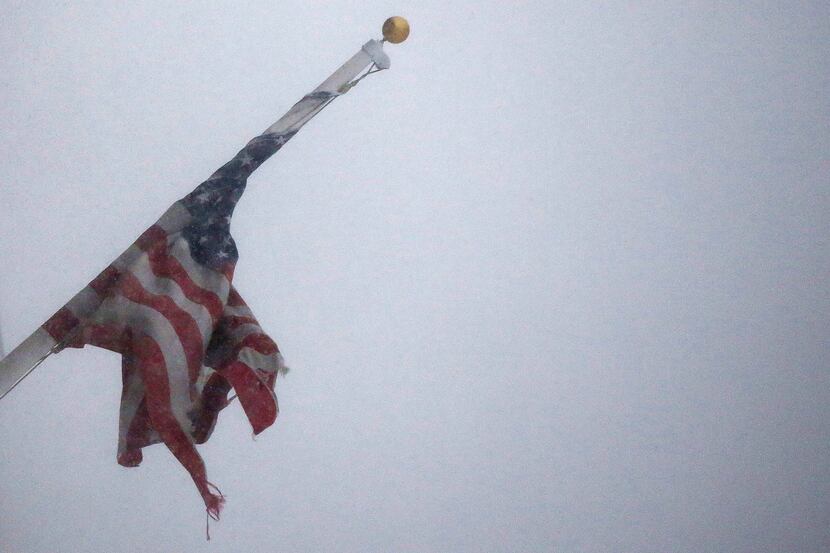  An American Flag flies in blizzard-like conditions on January 23, 2016 in the Brooklyn...