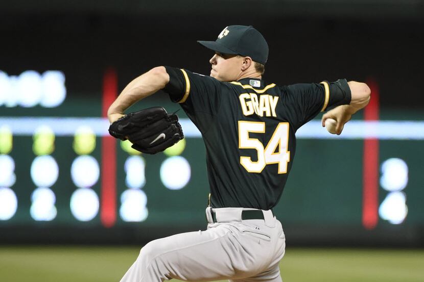 Oakland Athletics starting pitcher Sonny Gray (54) pitches against the Texas Rangers during...
