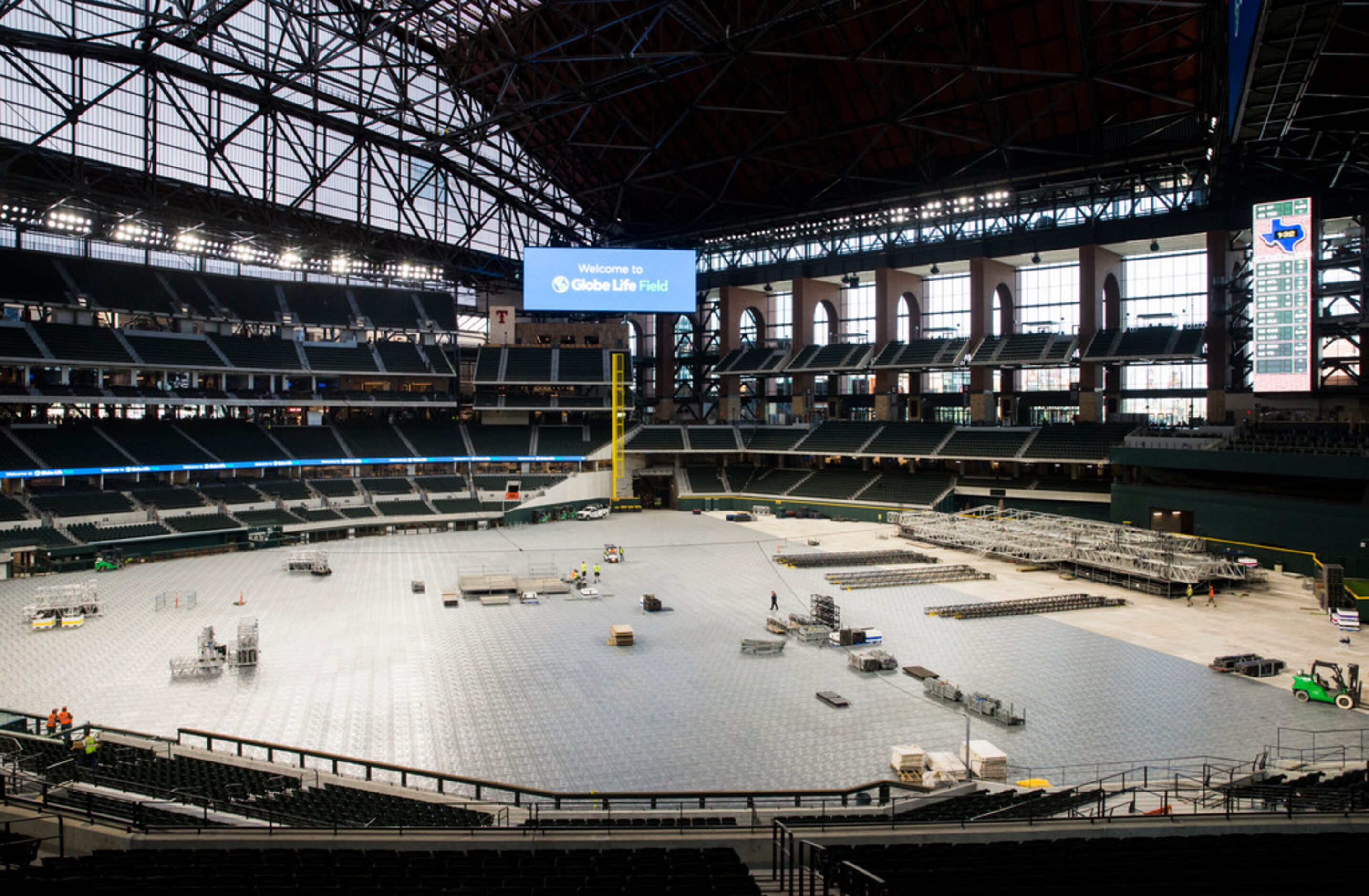 Flooring and a stage are assembled during an open house for the Texas Rangers' new Globe...