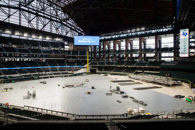 Flooring and a stage are assembled during an open house for the Texas Rangers' new Globe...