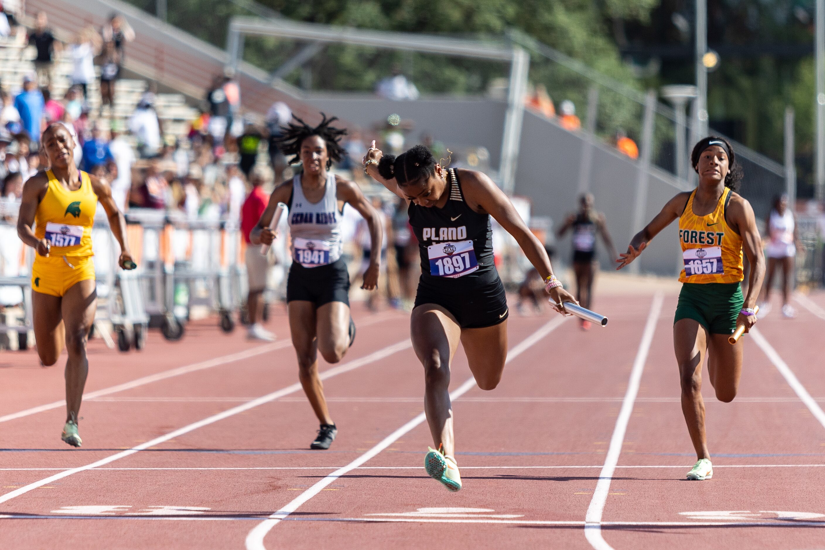 Tiriah Kelley of Plano East runs to a second-place finish in the girls' 4x100-meter relay at...