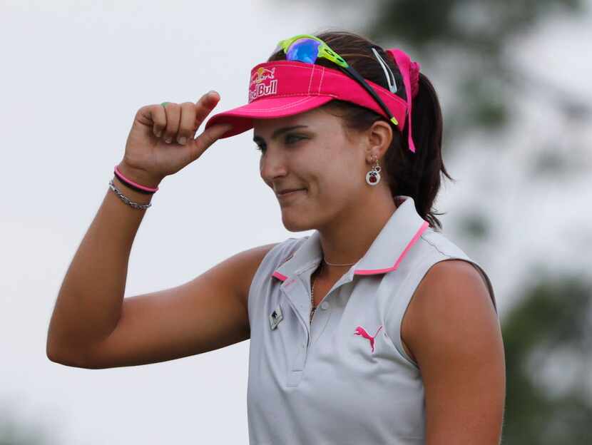 Lexi Thompson smiles after finishing round three of the LPGA 2015 Volunteers of America...
