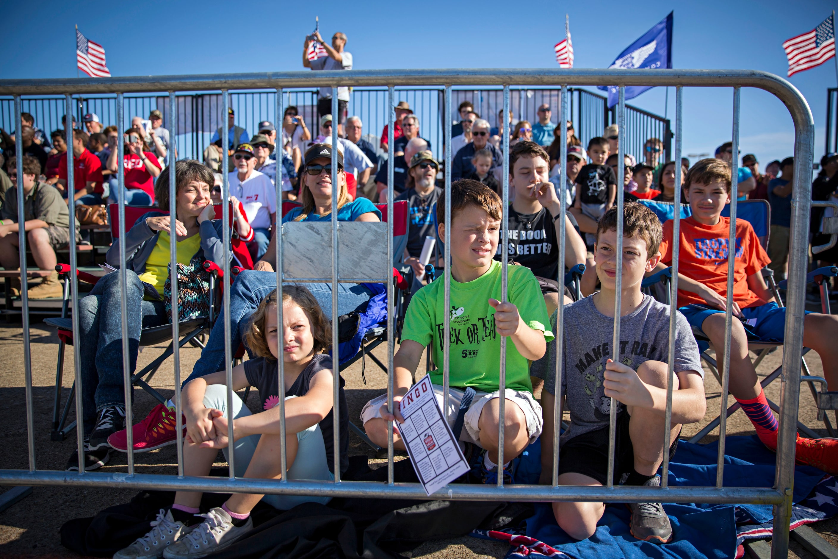 (From left) Grace Mason, Jake Smith and John William Mason watch during the Commemorative...