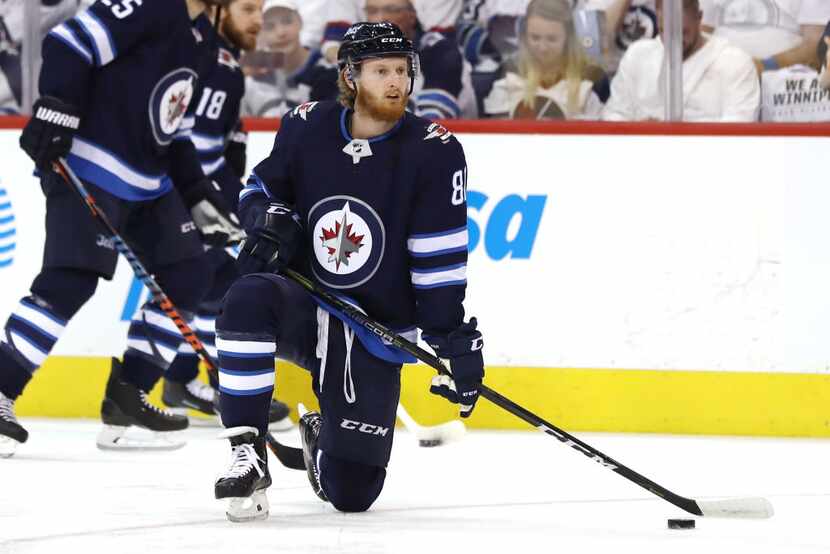WINNIPEG, MB - MAY 14: Kyle Connor #81 of the Winnipeg Jets skates in warm-ups prior to the...