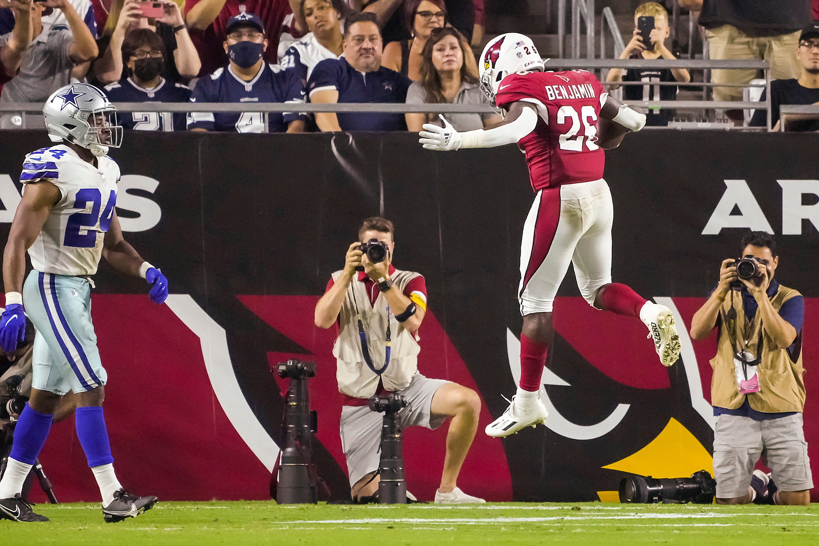 Arizona Cardinals running back Eno Benjamin (26) leaps into the end zone with a touchdown ...