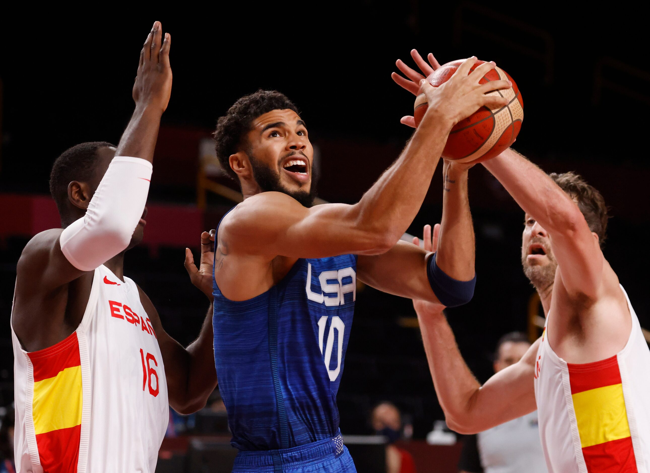 USA’s Jayson Tatum (10) attempts a shot in between Spain’s Unman Garuba (16) and Pau Gasol...