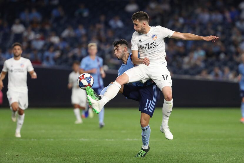 FC Cincinnati defender Mathieu Deplange, right, and New York City FC forward Valentin...