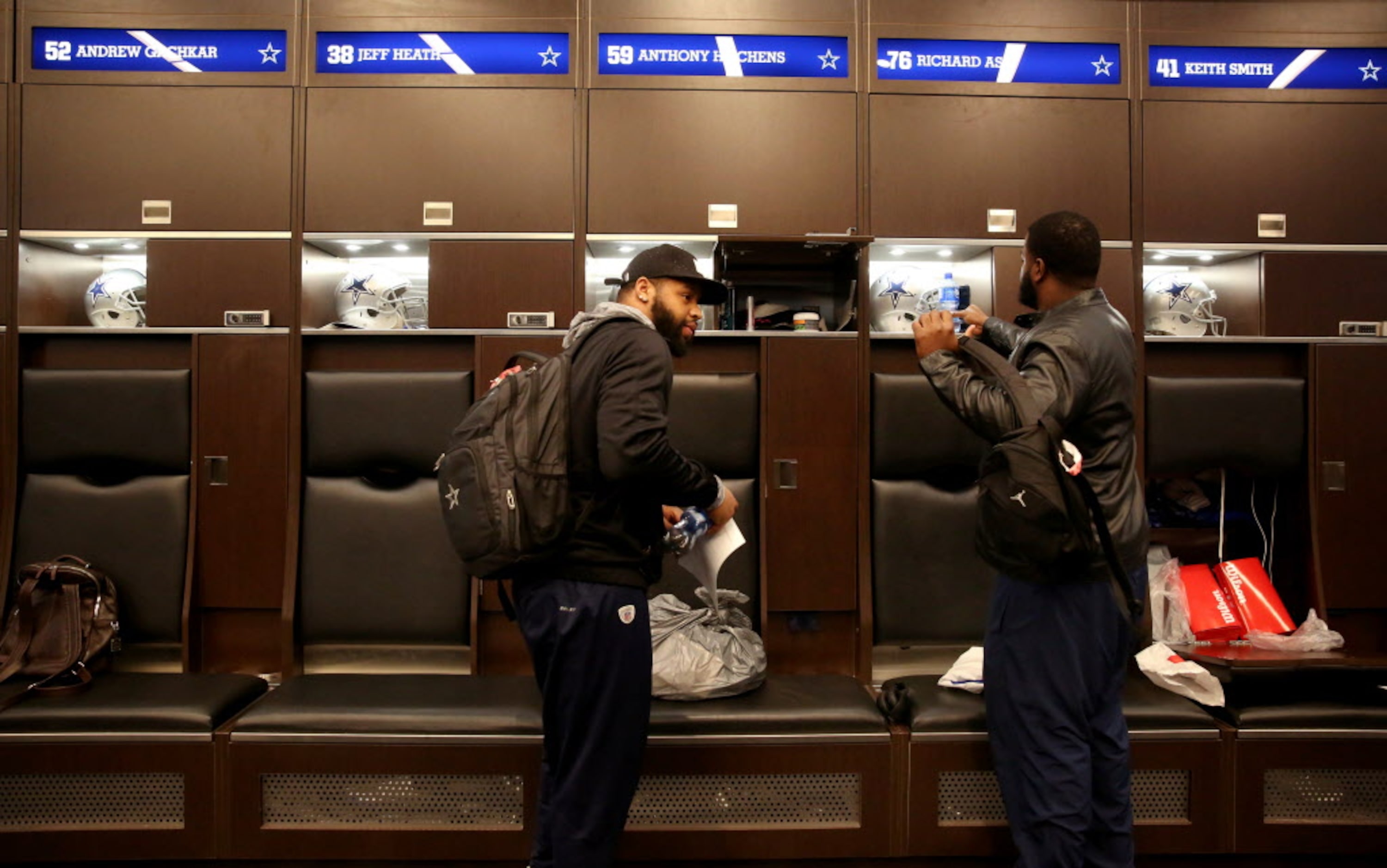 Dallas Cowboys linebacker Anthony Hitchens (left) and defensive tackle Richard Ash clean out...