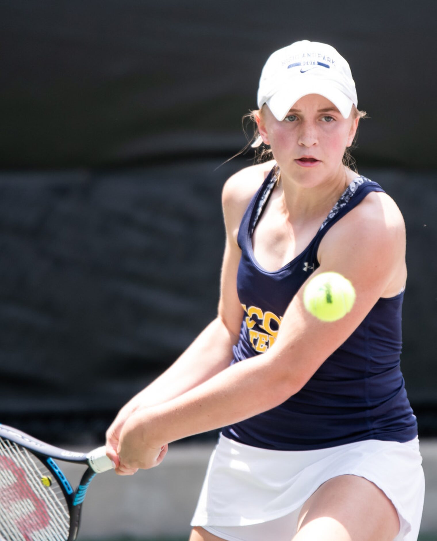 Highland Park's Cambelle Henderson returns the ball in a doubles match with teammate Brennan...