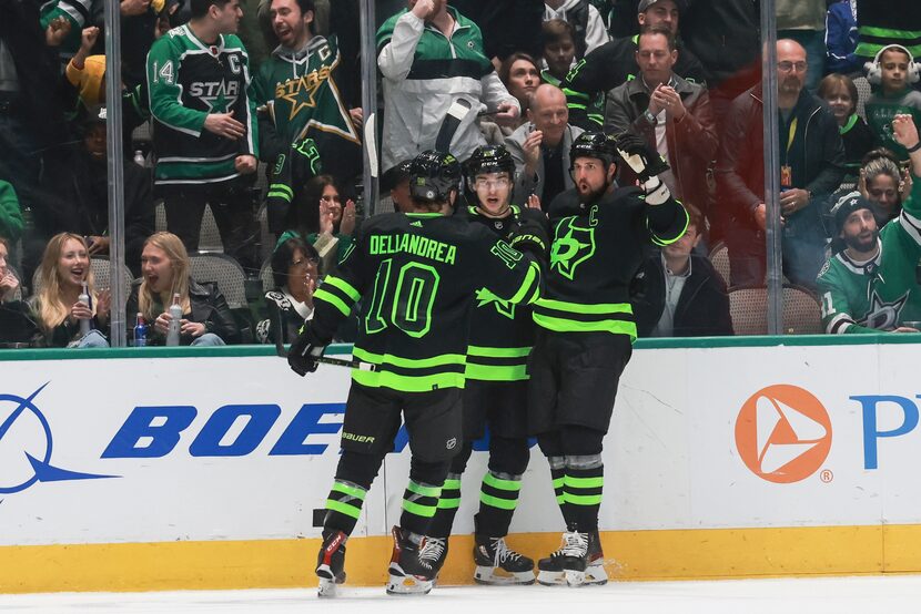 Dallas Stars center Ty Dellandrea (10) and Wyatt Johnston (53) celebrate with Jamie Benn...