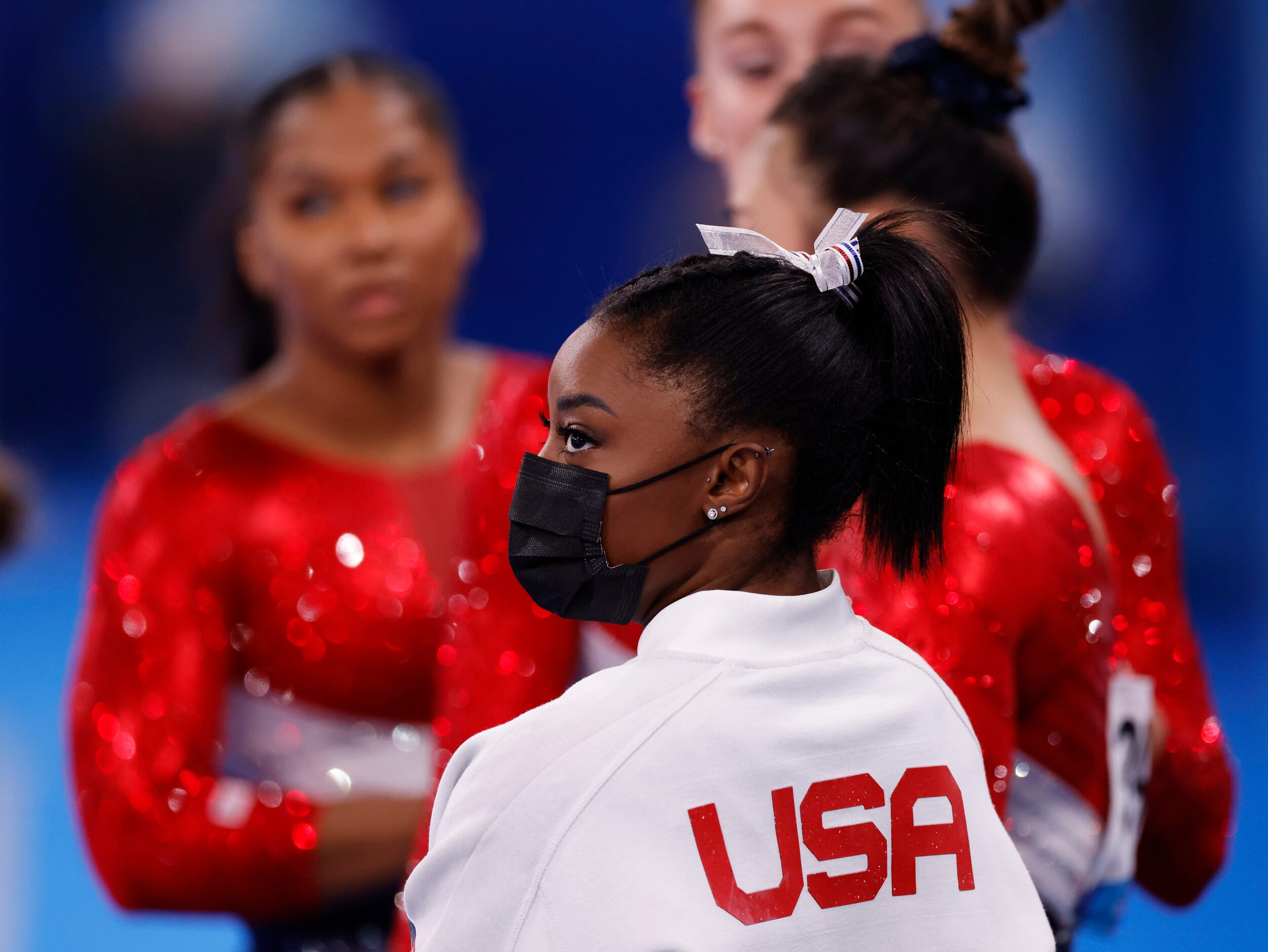 USA’s Simone Biles watches after pulling out of the competition after the vault event during...